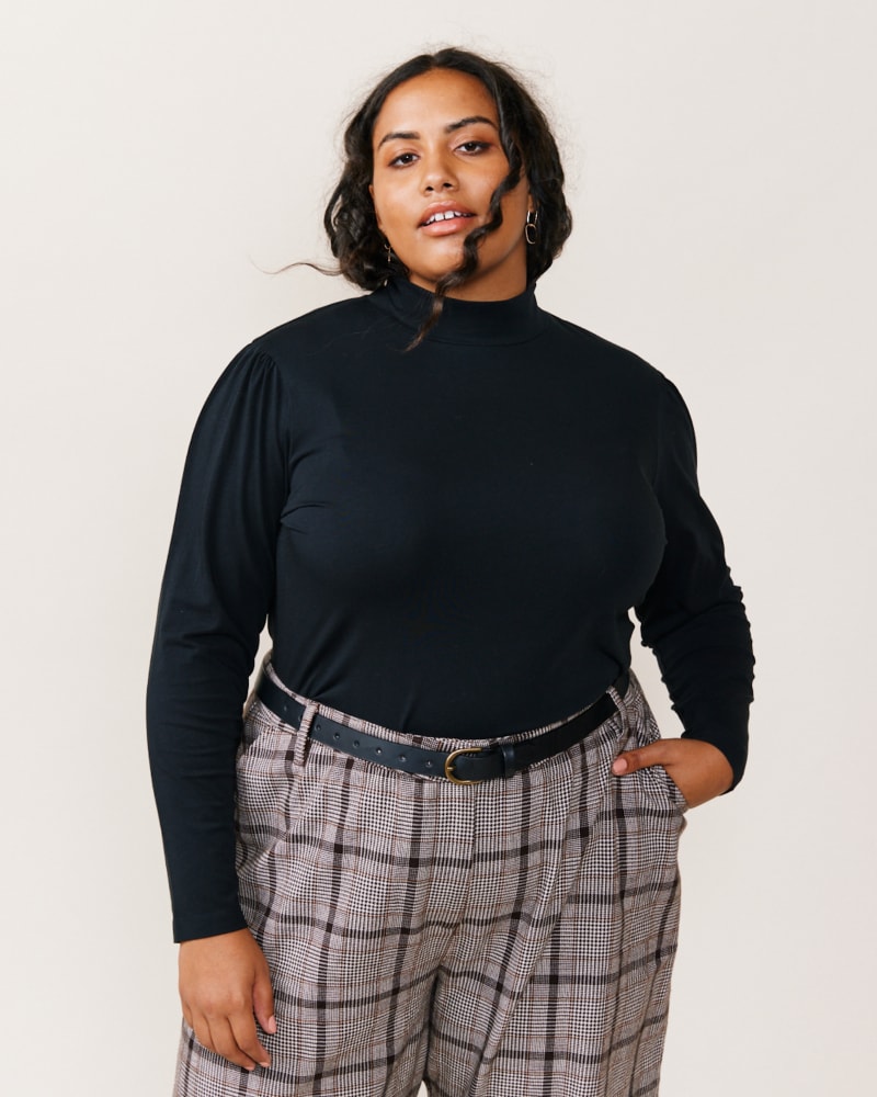 Front of a model wearing a size XXL Dorothy Mock Neck Tee in Black by ABLE. | dia_product_style_image_id:271523